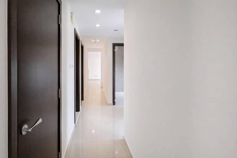 5 Modern hallway with open door view. png