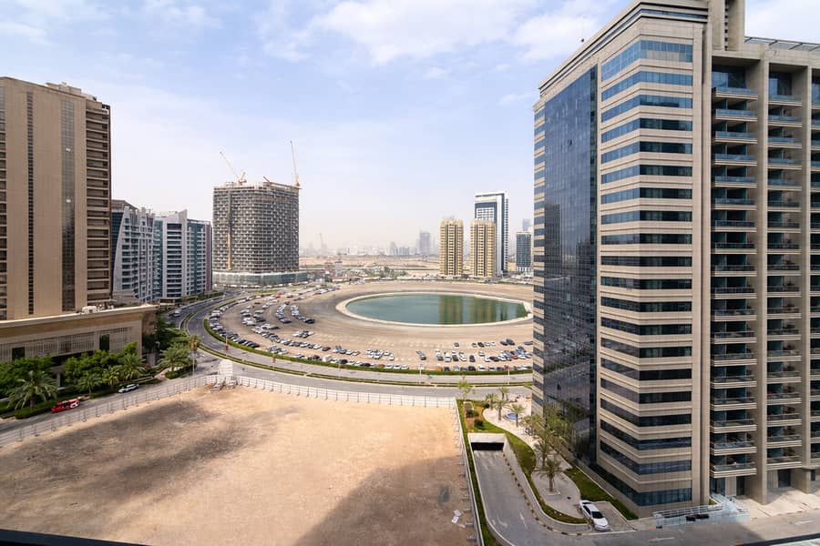 15 Modern cityscape with lagoon and towers. png