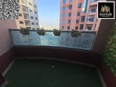 Apartment for rent in Al Nuaimiya Towers: 1 bedroom, living room, balcony with open view, prime location near services, AED 27,000 yearly.