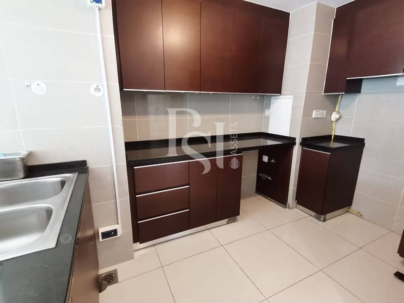 6 1-bedroom-abu-dhabi-al-reem-marina-sqaure-marina-blue-kitchen-1. jpg