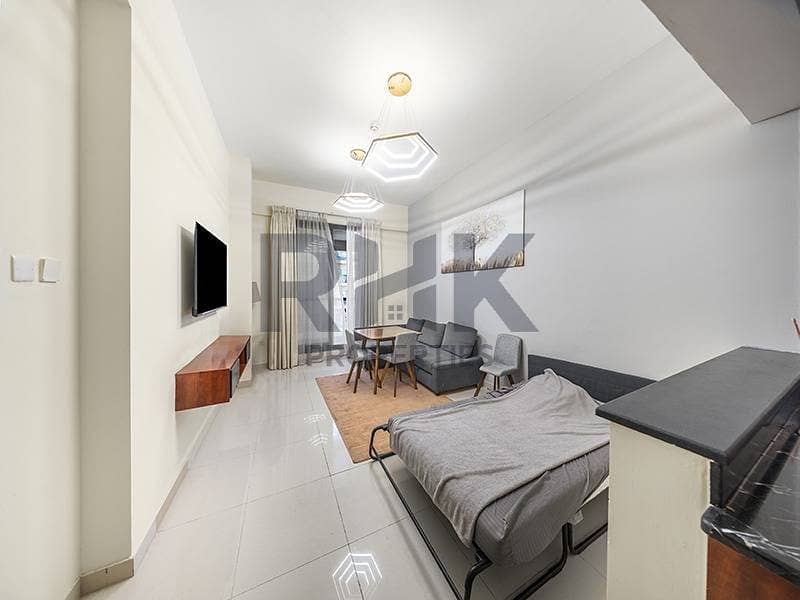 4 Bright living room with sofa bed and dining area in Dubai Marina flat