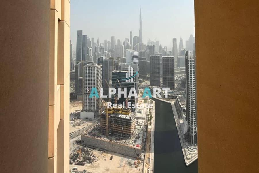 2BR Apartment | Burj & Canal Views | Balcony | Churchill Residence - Image 13