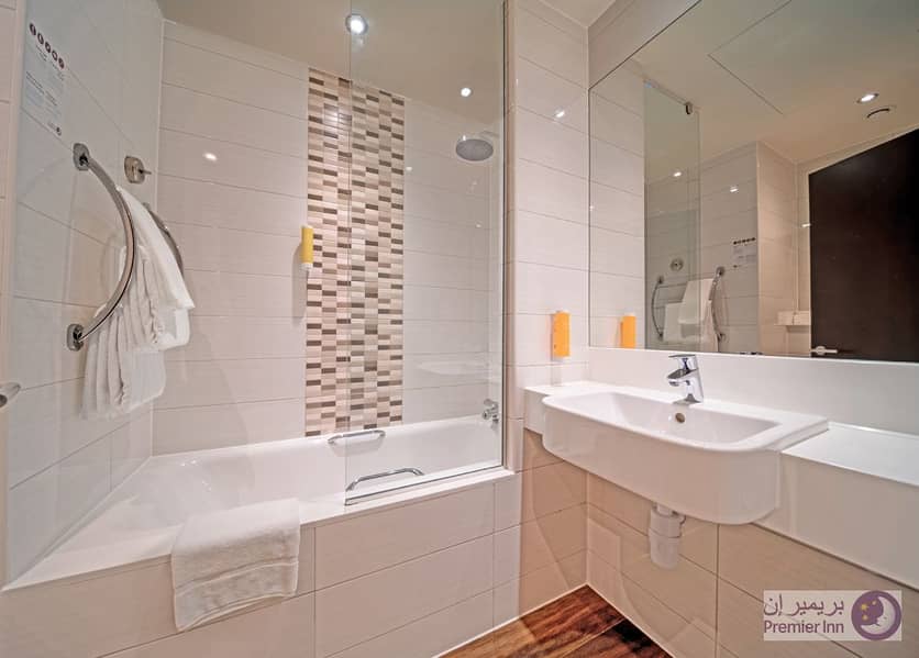 5 Premier-Inn-Al-Jaddaf---Bathroom---Shower-and-Bathtub. jpg