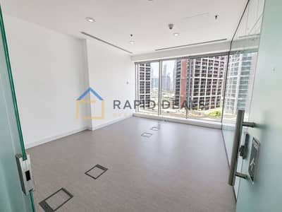 Office for Rent in Business Bay, Dubai - Well-Maintained Office Space with Glass Partitions