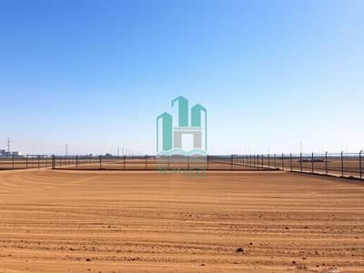 Industrial Land for Sale in Al Hamriyah, Sharjah - A_serene_empty_industrial_plot_featuring_bare_land_with_a_clear_blue_sky_above. _The_plot_is_surrounded_by_a_simple_fence_with_no_buildings_or_machinery_present. _The_ground_is_flat_and_covered_in_brown_earth_suggestin. jpeg Industrial Land for Sale in Al Hamriyah, Sharjah - A_serene_empty_industrial_plot_featuring_bare_land_with_a_clear_blue_sky_above. _The_plot_is_surrounded_by_a_simple_fence_with_no_buildings_or_machinery_present. _The_ground_is_flat_and_covered_in_brown_earth_suggestin. jpeg