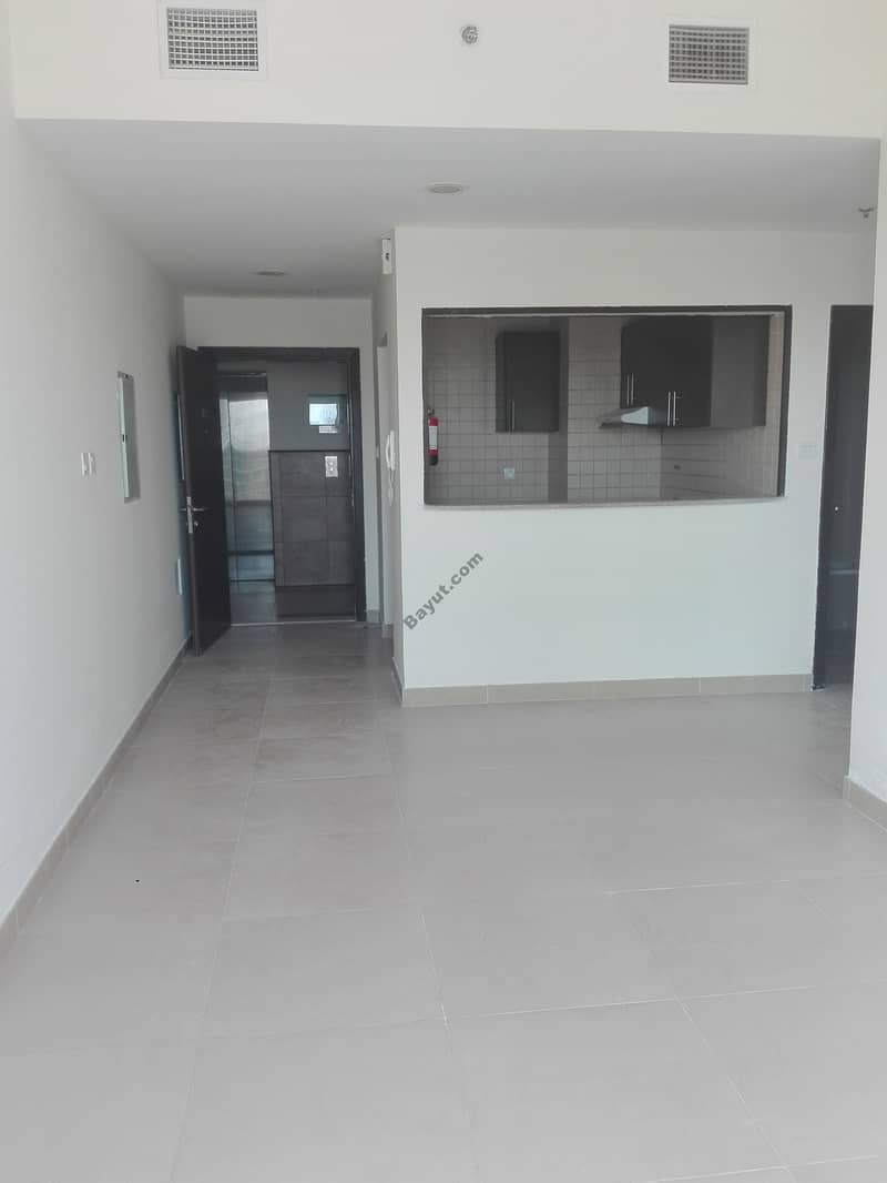 Price Reduced !!! VACANT- 1 Bedroom With Balcony with Nice Open View On Higher Floor Reserved Parking- In Liwan- Queue Point, Dubai Land.