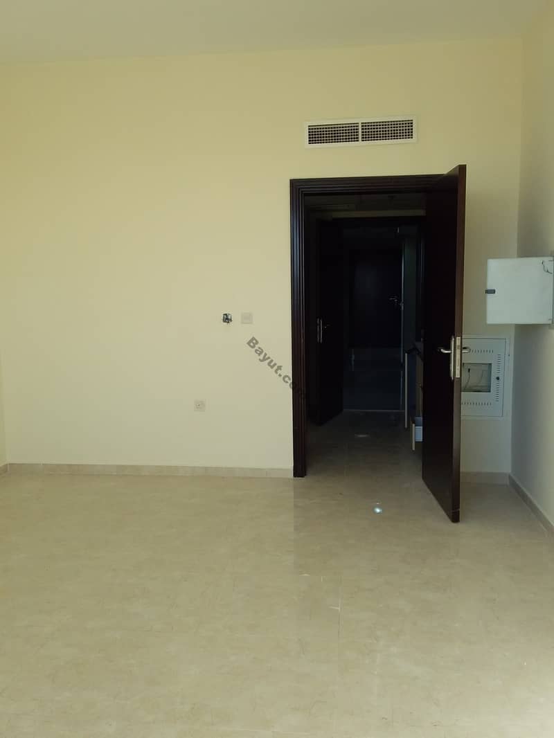 SPECIOUS   BIG SIZE  UNFURNISHED  STUDIO FOR RENT HOT OFFER JUST 14K YEARLY IN AJMAN .