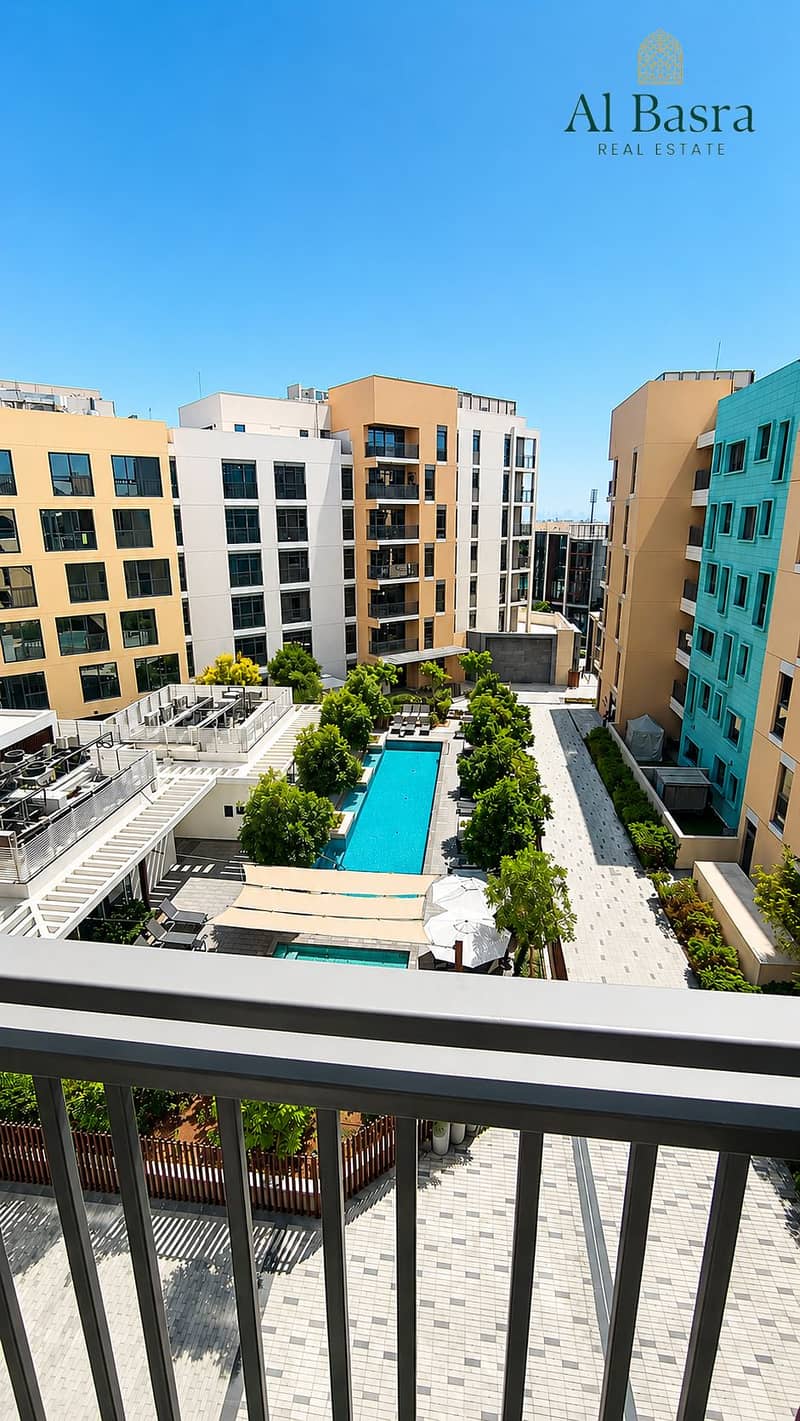 7 pool-view-studio-apartment-sharjah-with-large-windows. png