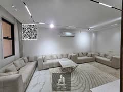 Ready to move in, registration fees included, furnished and air-conditioned, in a quiet and prime location, two floors, super deluxe finishing on Shei