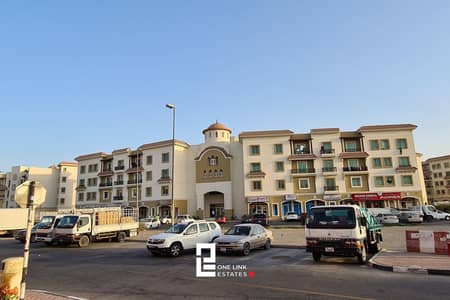 محل تجاري  للايجار في المدينة العالمية، دبي - greece-cluster-23905_xl. jpg