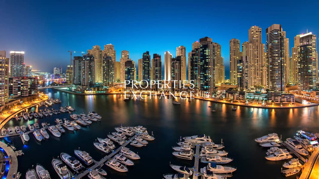 evening-view-across-dubai-marina-with-moored-boats-and-tall-buildings-in-the-background_16_9. webp evening-view-across-dubai-marina-with-moored-boats-and-tall-buildings-in-the-background_16_9. webp