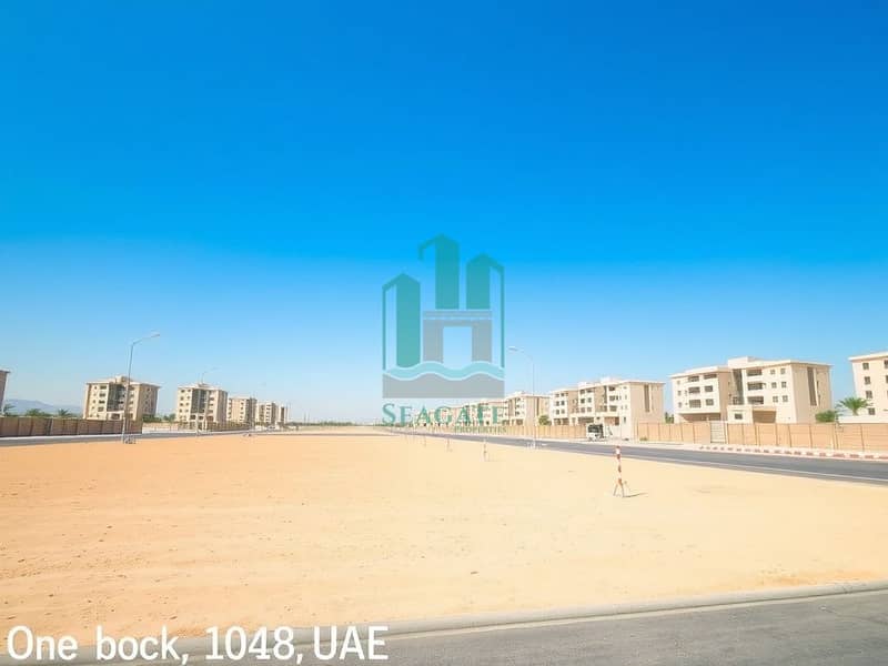 2 A_large_empty_residential_plot_in_the_UAE_situated_one_block_from_a_road. _The_scene_features_an_expansive_flat_sandy_terrain_without_trees_or_signs_creating_an_open_unobstructed_view. _The_sky_is_bright_blue_typical_o. jpeg