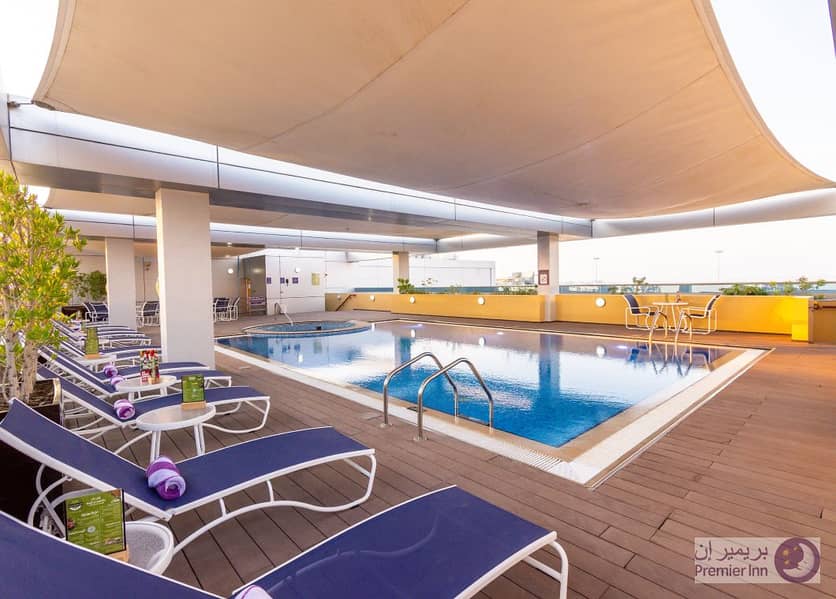 6 Premier-Inn-Abu-Dhabi-International-Airport-SwimmingPool. jpg