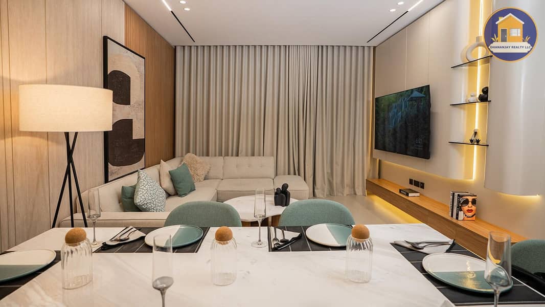 2 dining area in a 2 bedroom apartment for sale in Tulip Oasis 11 Majan. jpg