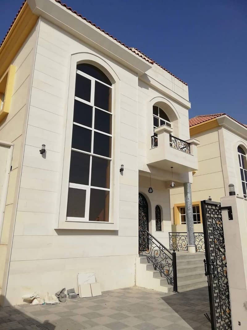 New villa opposite Ajman Academy, the second piece from the street