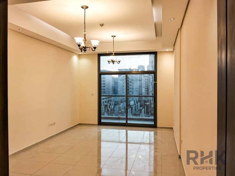 2 Spacious living room with chandelier and balcony in Altia Residence, Dubai Silicon Oasis apartment for rent