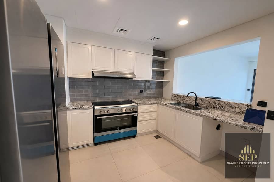 4 Modern L-shaped kitchen with blue range. png