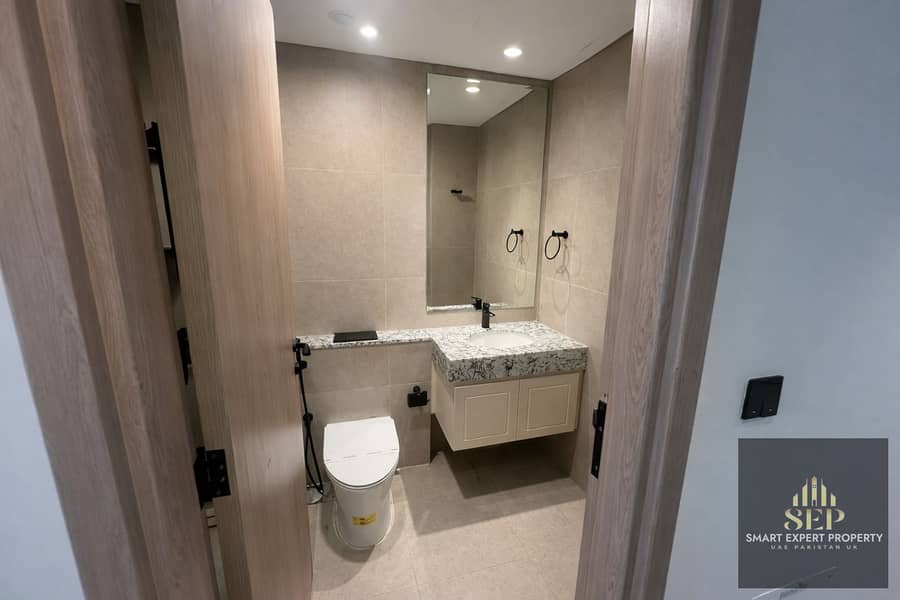 8 Modern bathroom with wooden door details. png