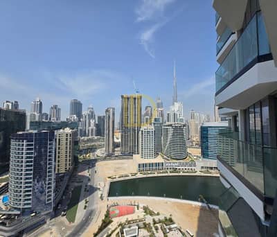 1 Bedroom Apartment for Rent in Business Bay, Dubai - Burj Khalifa View - Partial Canal - Kitchen Equipped