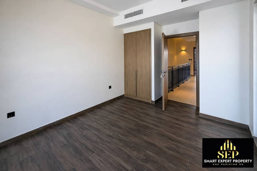 5 Modern empty bedroom with wood accents. png