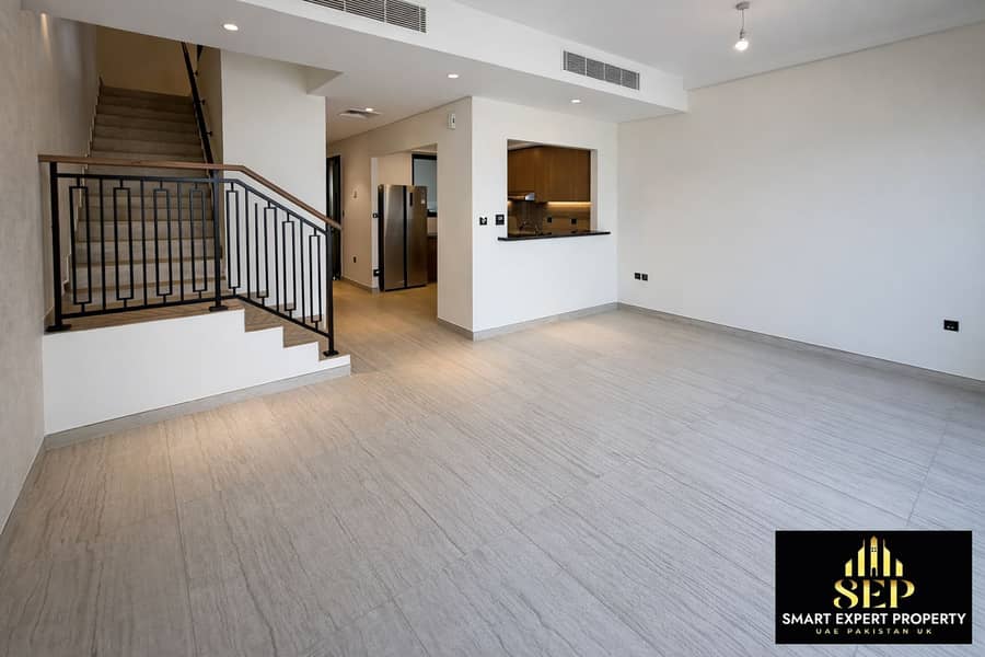 6 Modern living area with staircase and kitchen. png