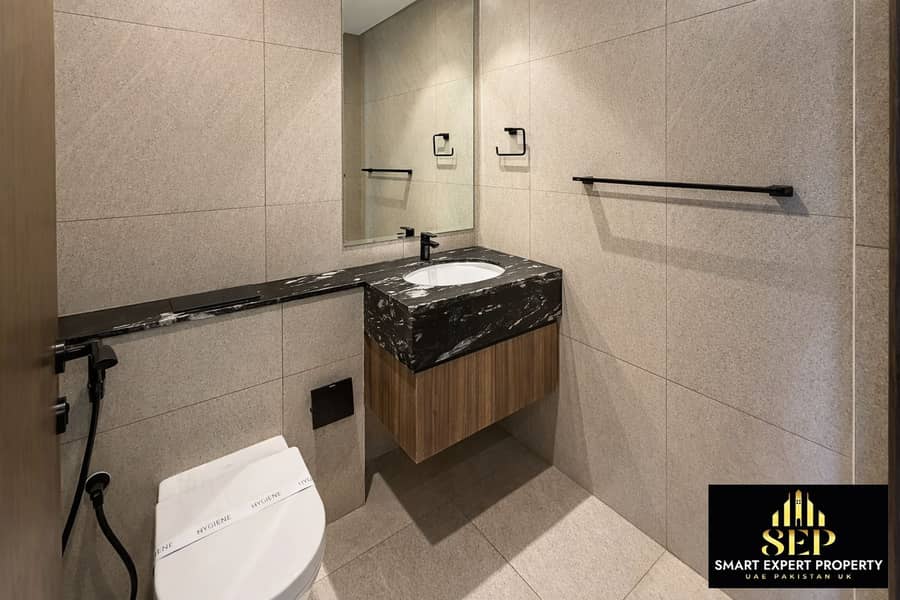 4 Modern bathroom with dark accents. png