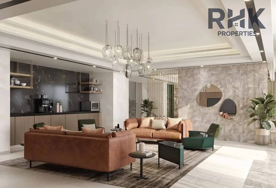 13 Azizi Venice communal lounge with leather sofas, marble wall and coffee station