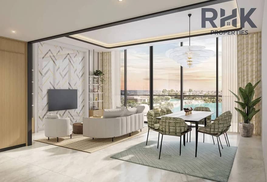 2 Open-plan living and dining room in Azizi Venice apartment with lagoon-facing windows