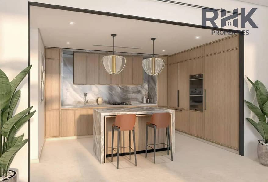 4 Modern fitted kitchen with marble island and breakfast bar in Azizi Venice apartment