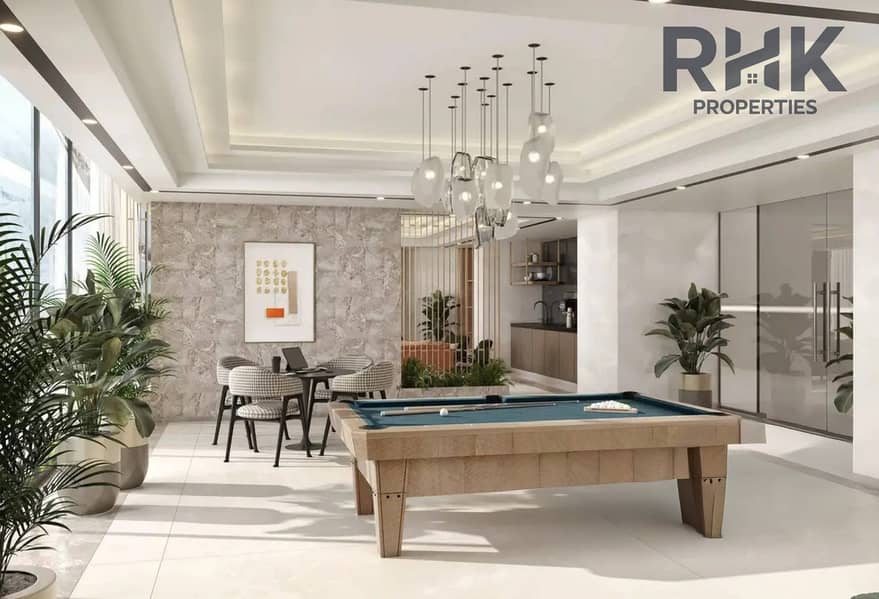 7 Azizi Venice residents lounge with pool table and lush indoor greenery