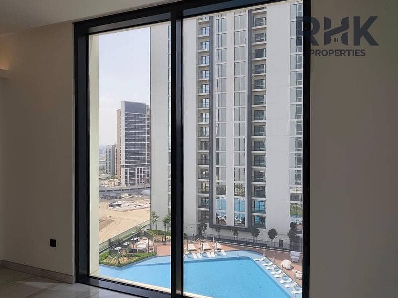 2 Pool and community views from Crest Grande apartment window, Sobha Hartland Dubai