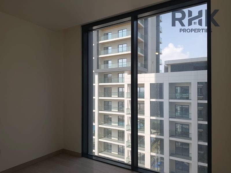 5 Bright bedroom with full-height glazing and tower views at Crest Grande, MBR City