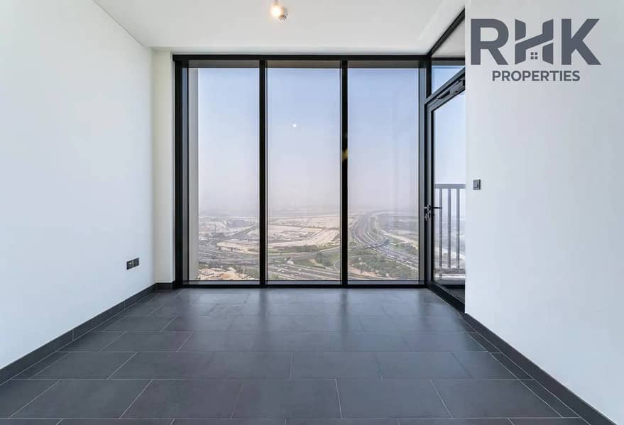 3 Empty bedroom with floor-to-ceiling windows and Ras Al Khor views, Sobha Hartland Dubai