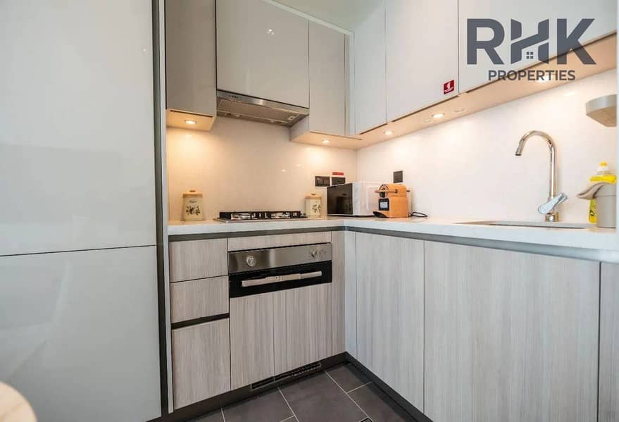 8 Compact fitted kitchen with sink, gas hob and oven, Sobha Hartland Dubai apartment