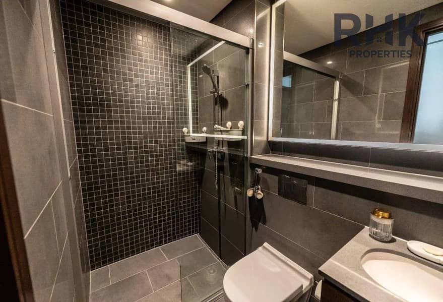 12 En-suite bathroom with LED mirror and glass shower, Sobha Hartland apartment Dubai