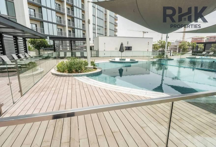 18 Shaded pool deck and jacuzzi amenity at Sobha Hartland residences, Dubai