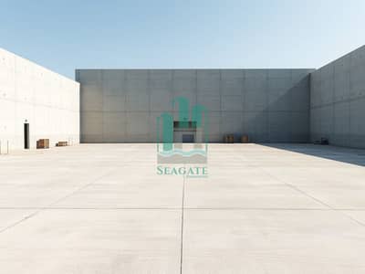 Warehouse in affitto a Al Sajaa, Sharjah - A_plain_industrial_yard_enclosed_by_a_high_compound_wall. _The_yard_is_vast_and_mostly_empty_featuring_a_flat_concrete_surface_with_a_few_scattered_industrial_items_like_pallets_and_crates. _No_heavy_machinery_or_conta. jpeg Warehouse in affitto a Al Sajaa, Sharjah - A_plain_industrial_yard_enclosed_by_a_high_compound_wall. _The_yard_is_vast_and_mostly_empty_featuring_a_flat_concrete_surface_with_a_few_scattered_industrial_items_like_pallets_and_crates. _No_heavy_machinery_or_conta. jpeg