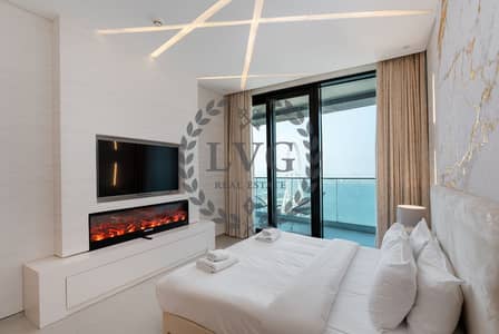 2 habitaciones Apartamento para en Alquiler en Jumeirah Beach Residence (JBR), Dubai - Beach View with Fireplace Heater and Electrical Curtains. png