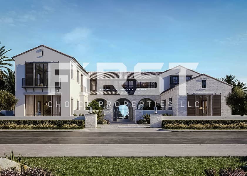 9 Mediterranean-style villa with arched windows, tiled roofs, and lush front landscaping in Wadeem community, Abu Dhabi. jpg