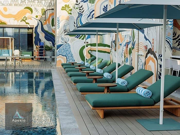 13 05-relax-on-a-cabana-or-a-sunbed-at-our-rooftop-pool. jpg