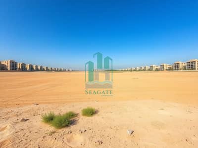 ارض سكنية للبيع في الجرف، عجمان - A_vast_and_expansive_empty_land_in_a_semi_urban_setting_showcasing_a_wide_stretch_of_sandy_terrain. _The_foreground_features_small_green_patches_of_grass_and_scattered_desert_plants_while_the_background_displays_a_dis. jpeg ارض سكنية للبيع في الجرف، عجمان - A_vast_and_expansive_empty_land_in_a_semi_urban_setting_showcasing_a_wide_stretch_of_sandy_terrain. _The_foreground_features_small_green_patches_of_grass_and_scattered_desert_plants_while_the_background_displays_a_dis. jpeg