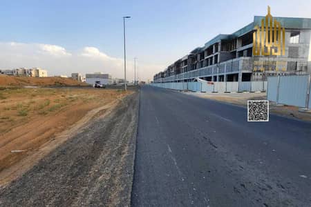 Plot for Sale in Al Helio, Ajman - Commercial land on a main street, fees included