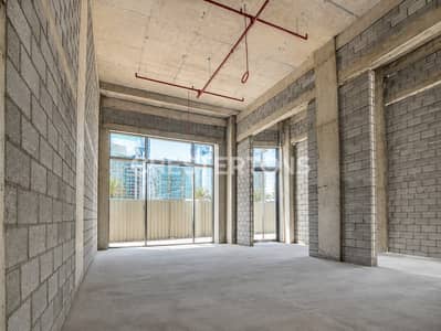 Shop for Rent in Dubai Land Residence Complex (DLRC), Dubai - Street Facing | August Handover | Shell & Core