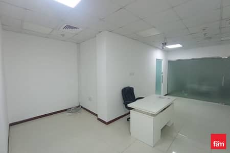 Office for Rent in Business Bay, Dubai - Vacant | 2 partitions | Semi furnished | Bright
