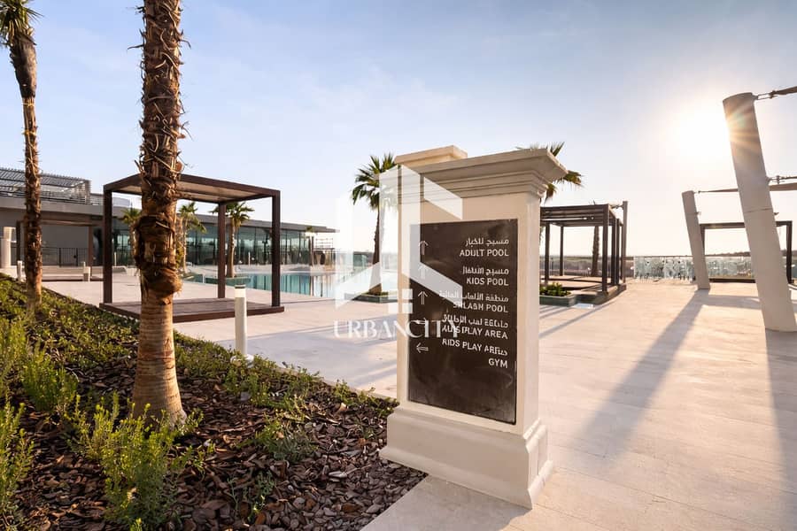 4 Elegant poolside sign at sunset. png
