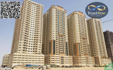 Appartement de 1 chambre à à vendre à Emirates City, Ajman - Apartment_buildings_مدينة الامارات. jpg