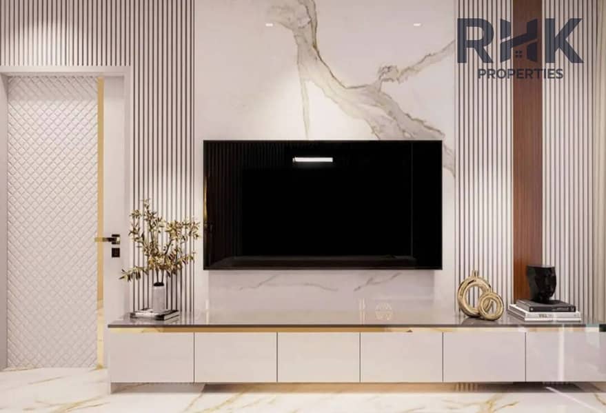 12 Living room TV feature wall in Danube Oasis Dubai apartment with marble and fluted panel finish