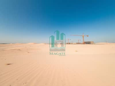 Industrial Land for Sale in Al Sajaa Industrial, Sharjah - A_wide_angle_view_of_an_industrial_plot_in_the_UAE_showcasing_a_vast_expanse_of_smooth_sand_with_faint_markings_indicating_future_development_areas. _The_terrain_is_dry_and_light_beige_dotted_with_sparse_grasses_and_s. jpeg Industrial Land for Sale in Al Sajaa Industrial, Sharjah - A_wide_angle_view_of_an_industrial_plot_in_the_UAE_showcasing_a_vast_expanse_of_smooth_sand_with_faint_markings_indicating_future_development_areas. _The_terrain_is_dry_and_light_beige_dotted_with_sparse_grasses_and_s. jpeg