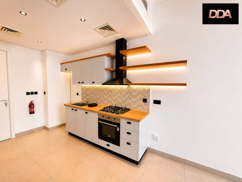 4 socio-tower-b-studio-open-plan-kitchen-living-area-01. png