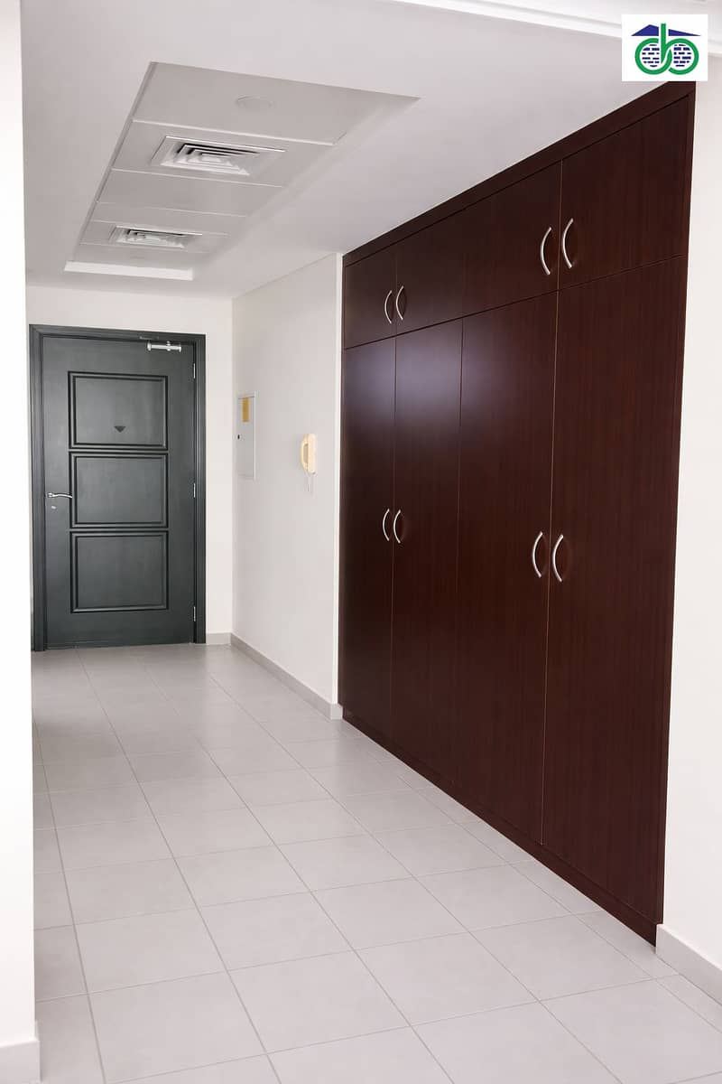 2 Sleek modern hallway with dark wardrobes. png